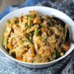 Chorizo Sausage and Green Bean Casserole in a serving bowl are a creamy and savory side dish. One of the best holiday side dishes.