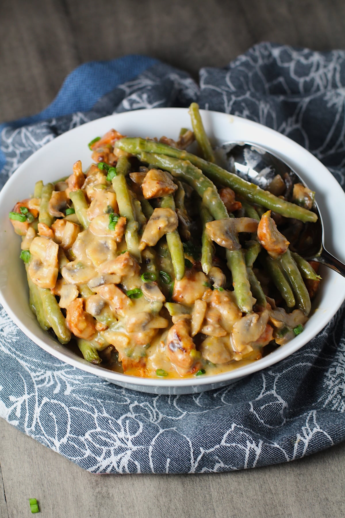 Chorizo Sausage and Green Bean Casserole in a serving bowl are a creamy and savory side dish.