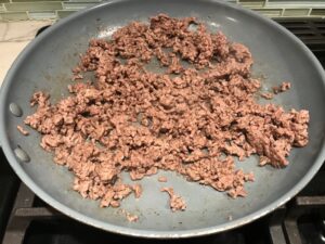 Ground Beef cooked in a skillet for Korean Beef and Rice Bowls.