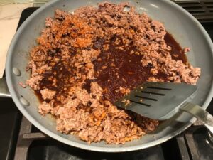 Korean Ground Beef cooked in a skillet for Korean Beef and Rice Bowls.