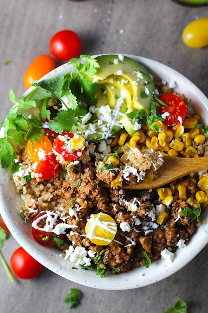 Quinoa with Ground Beef and Corn Taco Bowls - Talking Meals