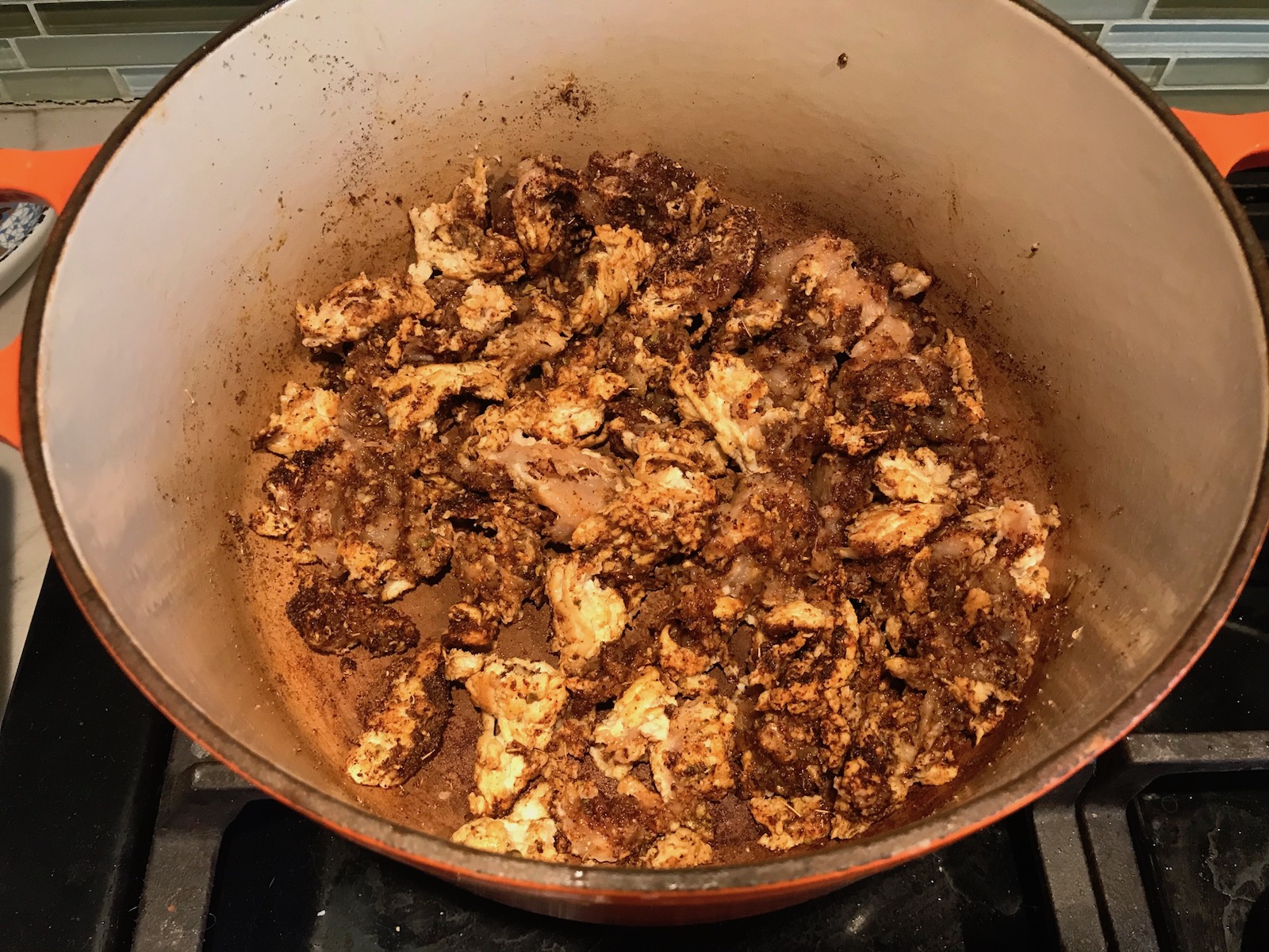 Seasoned ground chicken cooking in pot for Tex Mex Unstuffed Peppers with Ground Chicken.  Juicy Sweet Bell Peppers are chopped up and cooked with the Tex Mex style ground chicken, tomatoes, Mexican seasonings, cheese, rice and corn tortillas.