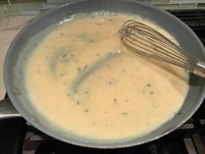 Whisk stirring thickened sauce leave a track on bottom of large frying pan for Velvety Barley Recipe with Bacon and Gruyere Cheese.  It's creamy, rich, nutty, smokey, hearty, and utterly delicious.