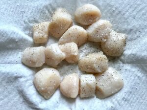 Raw scallops on paper towel for Glazed Pan Seared Scallops with Garlic and Honey.
