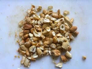 Cashews chopped on cutting board for this Cashew Chicken Lettuce Wrap Recipe