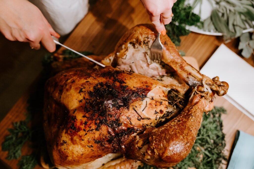 Picture of Turkey being carved for Thanksgiving Dinner Meal Planner & Prep Guide