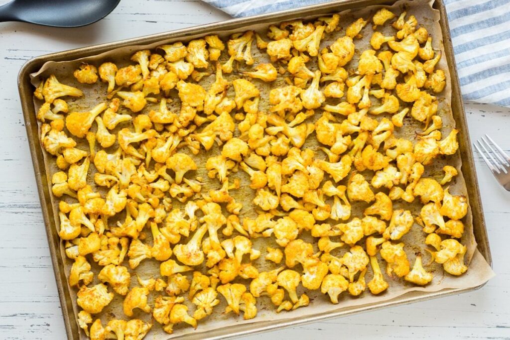 What to serve with pasta bake? This Turmeric Roasted Cauliflower Recipe from Hot Pan Kitchen.