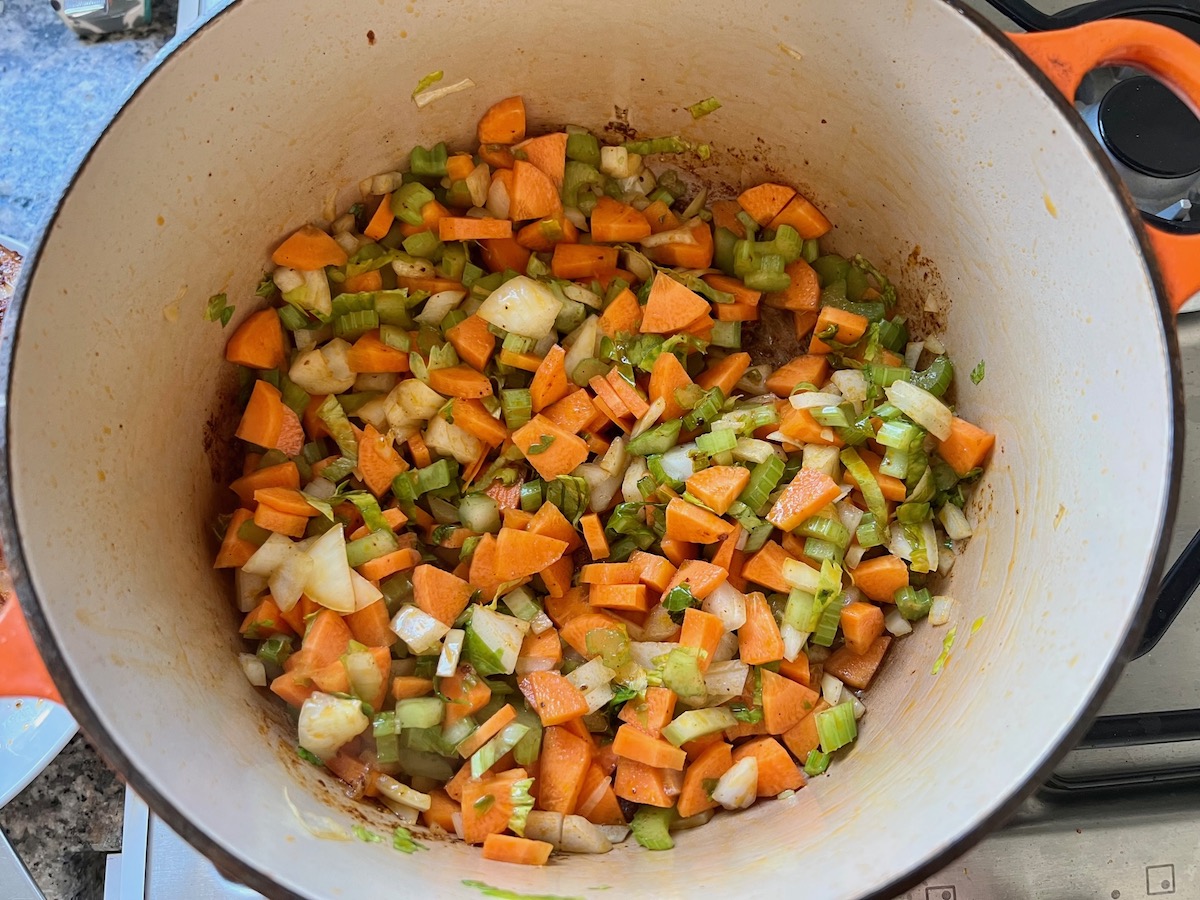 Carrots, onions, celery, in pot for Spanish Chicken Soup Recipe.