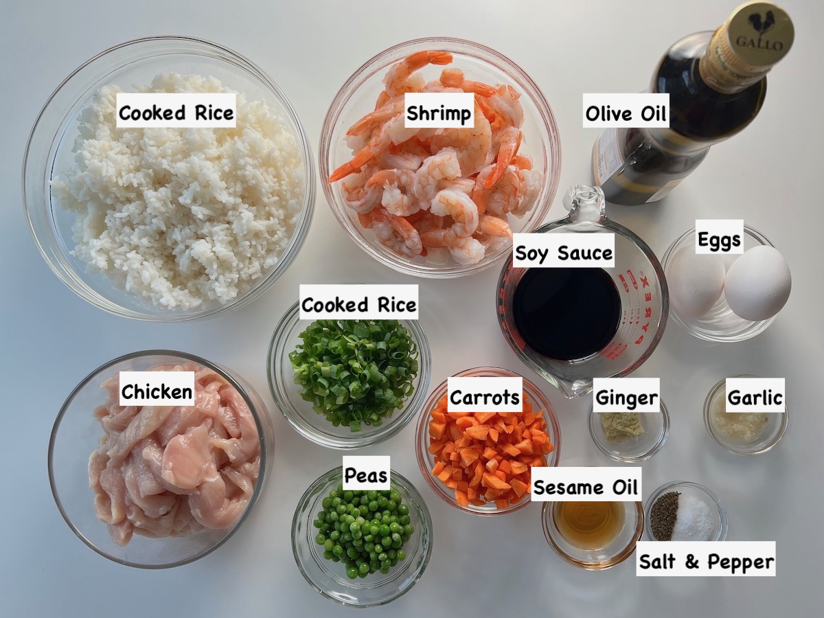 Ingredients prepped and measured out in bowls for the Shrimp and Chicken Fried Rice recipe.