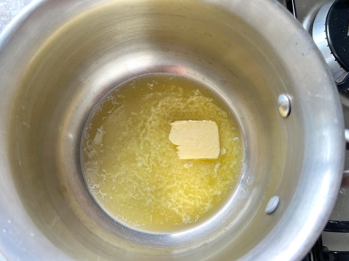 Butter melting in a pot for the roux for the Creamy chicken piccata Casserole recipe.