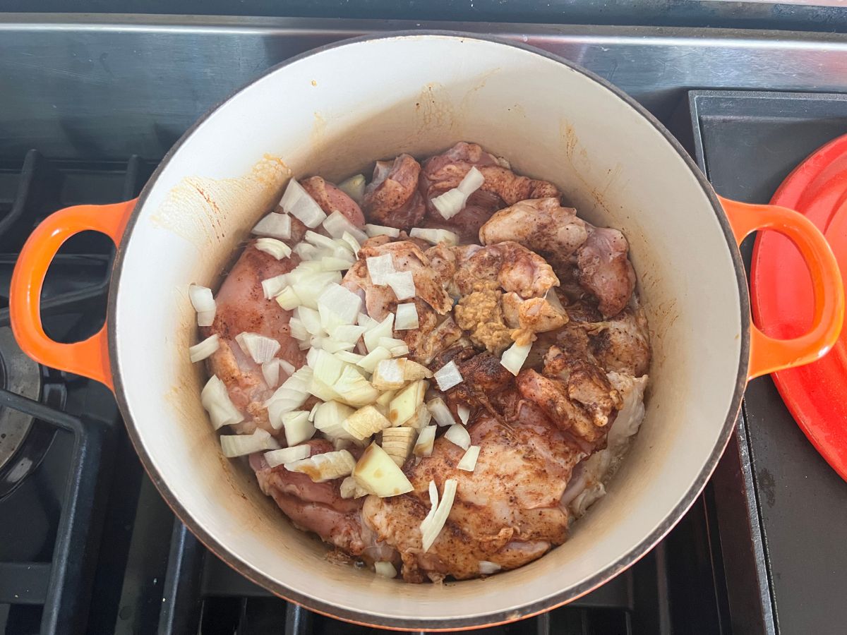 Onions and garlic added to the Dutch oven.