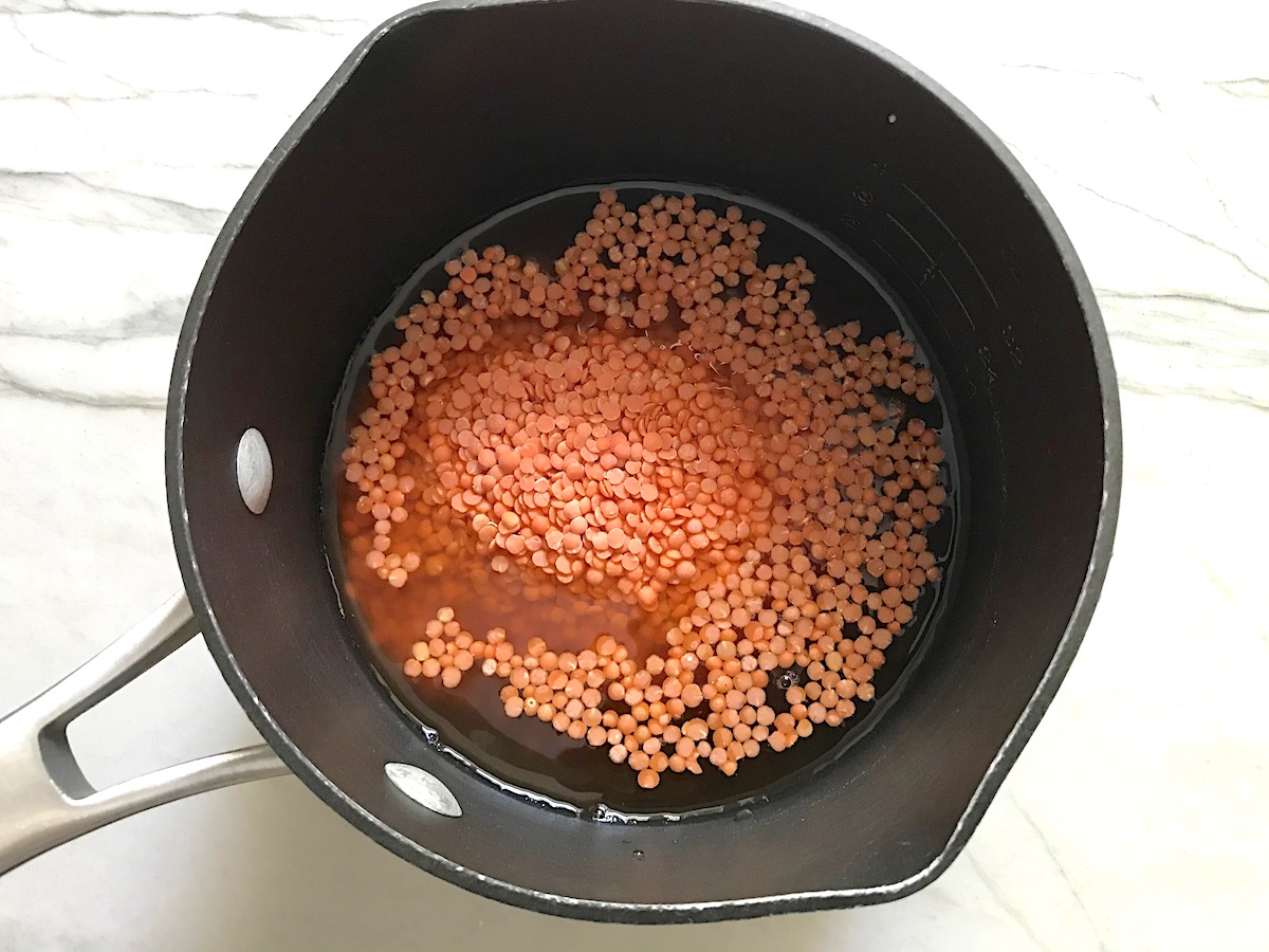 Uncooked red lentils added to pot with water for the Vegetarian Sloppy Joes recipe.
