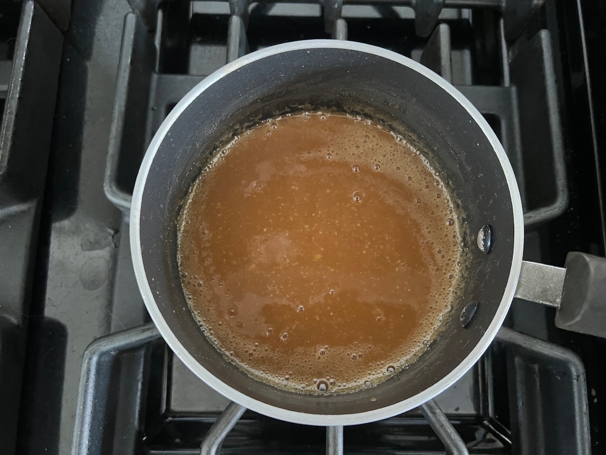 Miso glaze marinade cooking down in a saucepan for the Glazed Miso Cod Recipe.