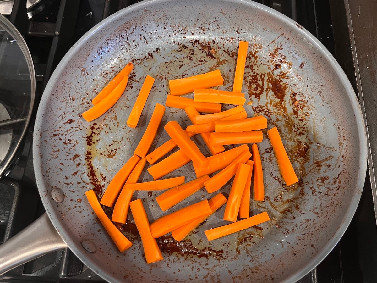 Carrot sticks added to pan after chicken was removed for this Chicken Stir Fry Recipe.