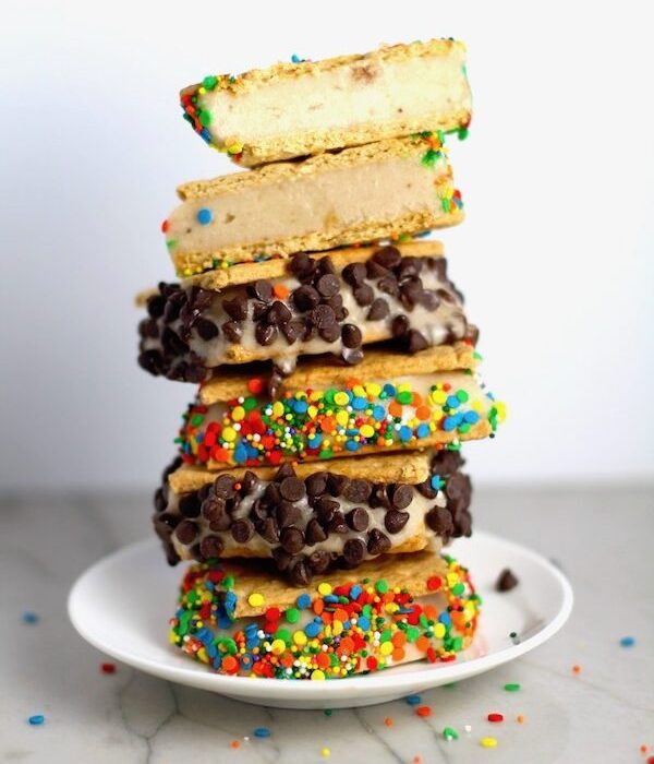 Banana almond milk Ice Cream Sandwiches with Sprinkles and chocolate chips stacked on top of each other.