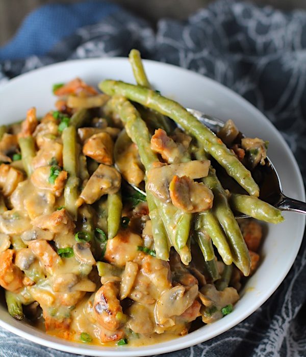 Chorizo Sausage and Green Bean Casserole in a serving bowl are a creamy and savory side dish.
