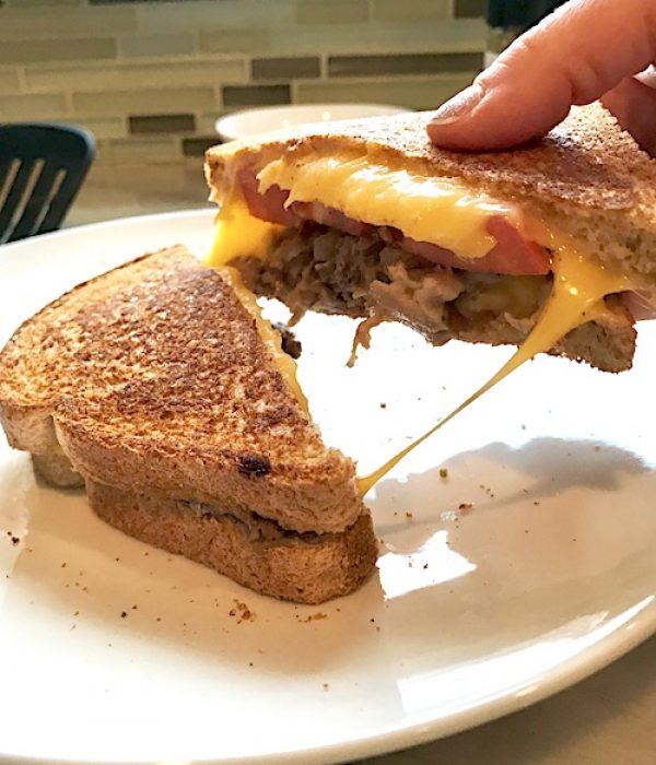 Grilled Pork Cheese Sandwich pulling cheese stretching