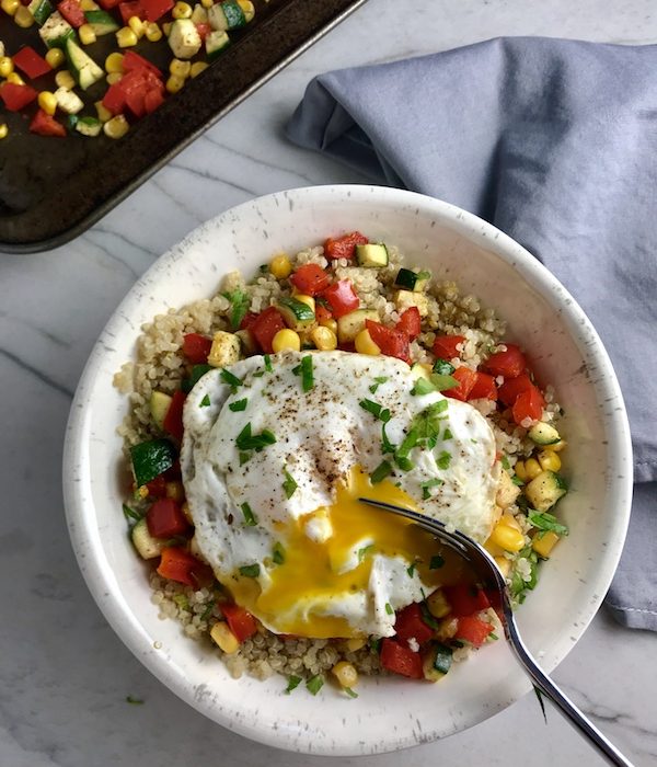 This 5-ingredient Sunny Quinoa with Fried Egg & Veggie Medley is simple, but incredible. The Veggie Medley is a trifecta of red pepper, zucchini, and sweet corn that are roasted on a sheet pan. Then on top of it all is a salty fried egg with a runny yoke that oozes out to bring a deep creaminess to the entire dish.